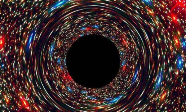 Cette image simulée par ordinateur montre un trou noir supermassif au cœur d’une galaxie. La région noire au centre représente l’horizon du trou noir, où aucune lumière ne peut échapper à la prise gravitationnelle de l’objet massif. La puissante gravité du trou noir déforme l’espace autour de lui comme un miroir déformant de parc d’attractions. La lumière des étoiles d’arrière-plan est étirée et étalée alors que les étoiles survolent le trou noir. (Image: NASA, ESA et D. Coe, J. Anderson et R. van der Marel